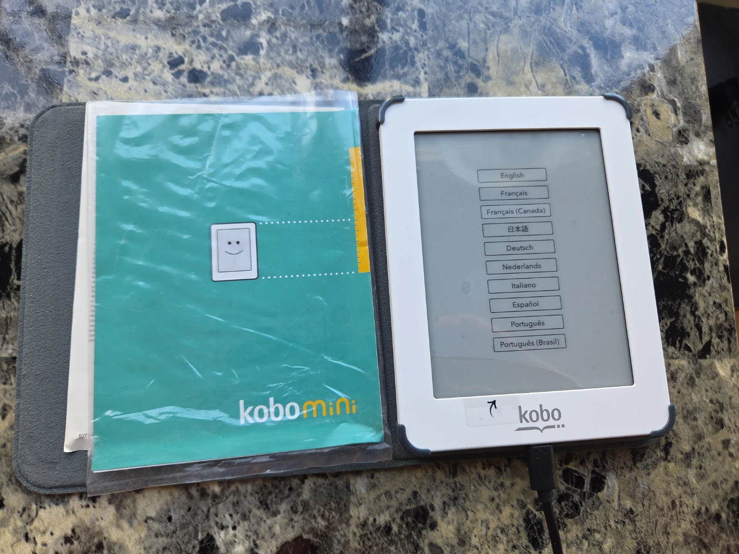 Kobo Mini eReader. Never Used. Original Screen Film Attached