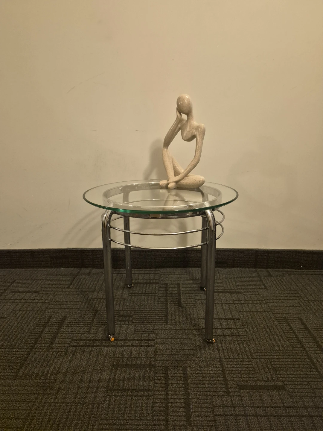 Glass top side table with silver legs and wheels - photo 5