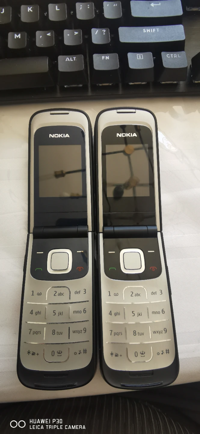 Two 2G Nokia Flip Phones
