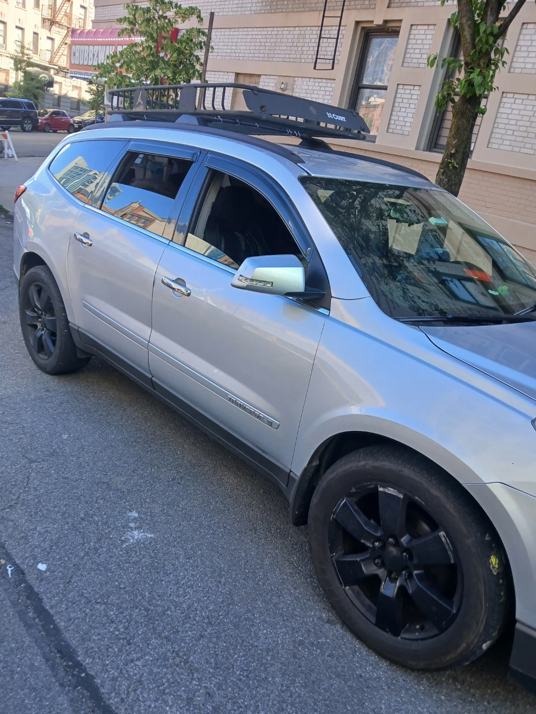 Silver Chevrolet Traverse with Roof Rack - photo 2