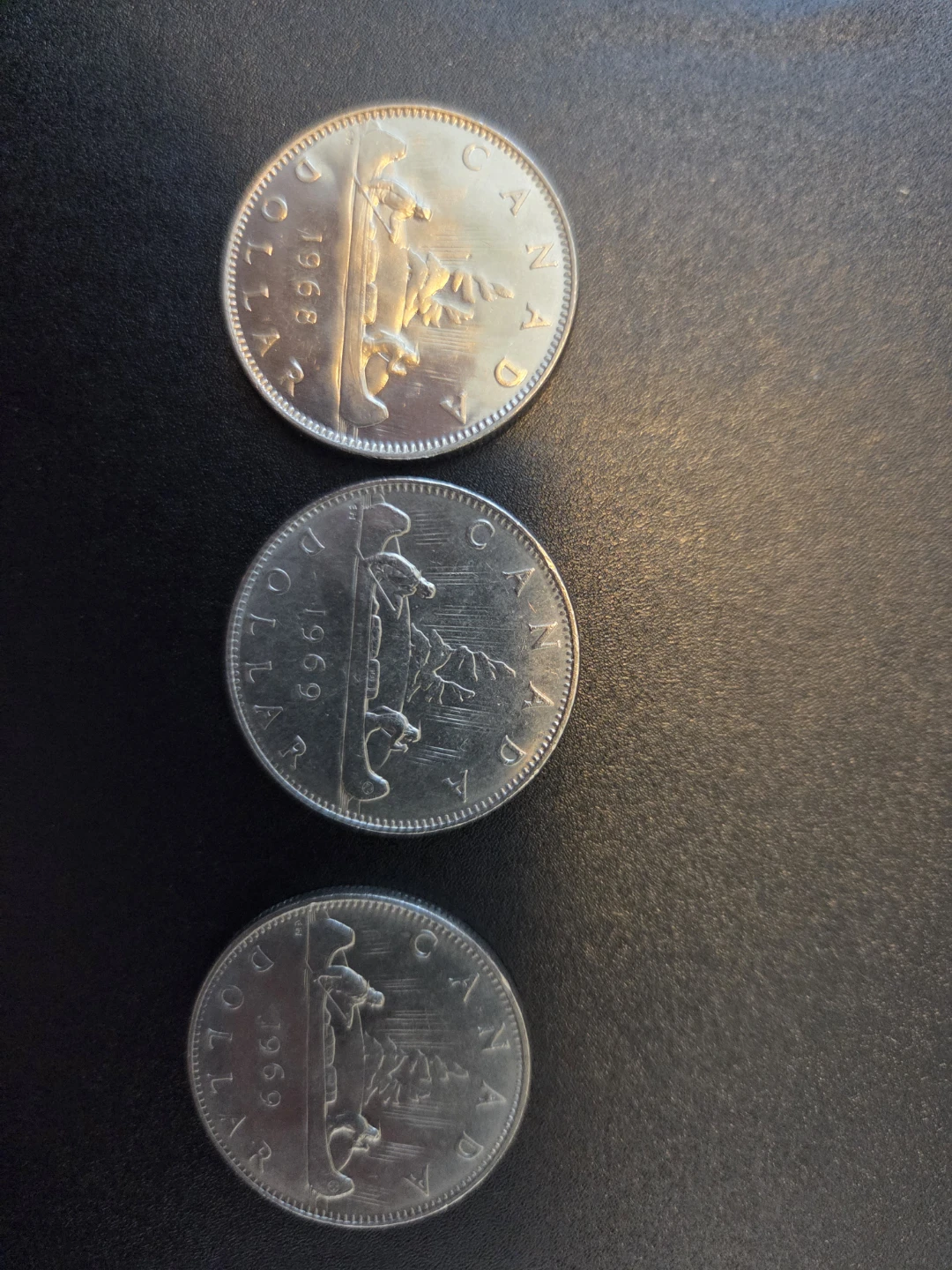 Three 1969 Canadian Dollar Coins