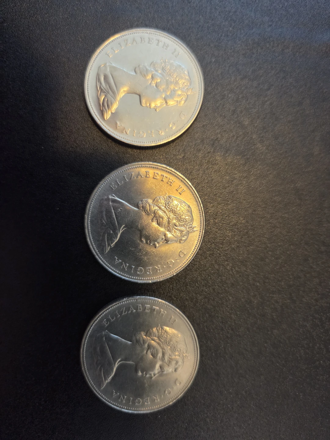 Three 1969 Canadian Dollar Coins - photo 2