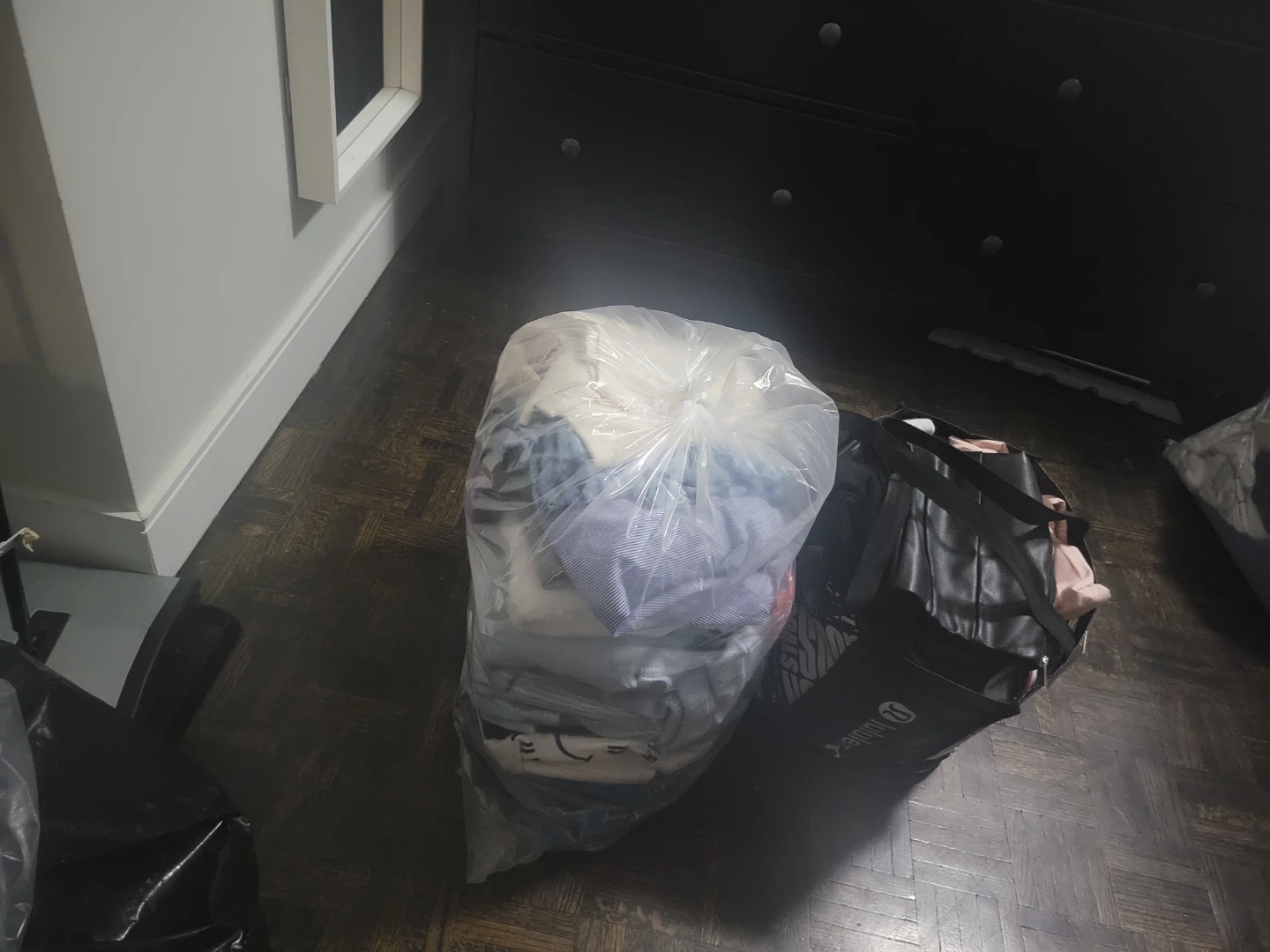 Lululemon bag and assorted clothing bundle
