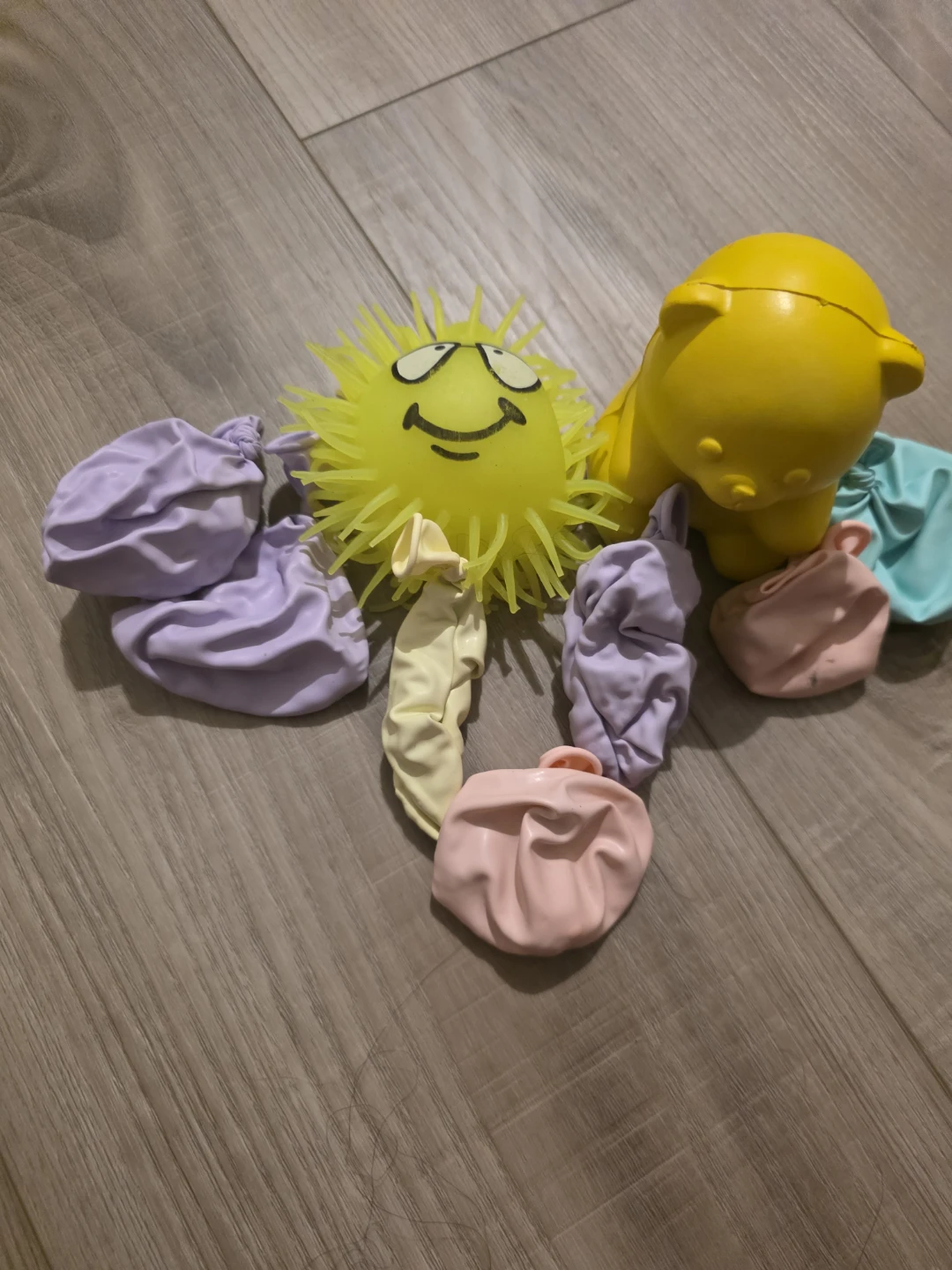 Yellow Smiley Face Spiky Ball & Water Balloons Set