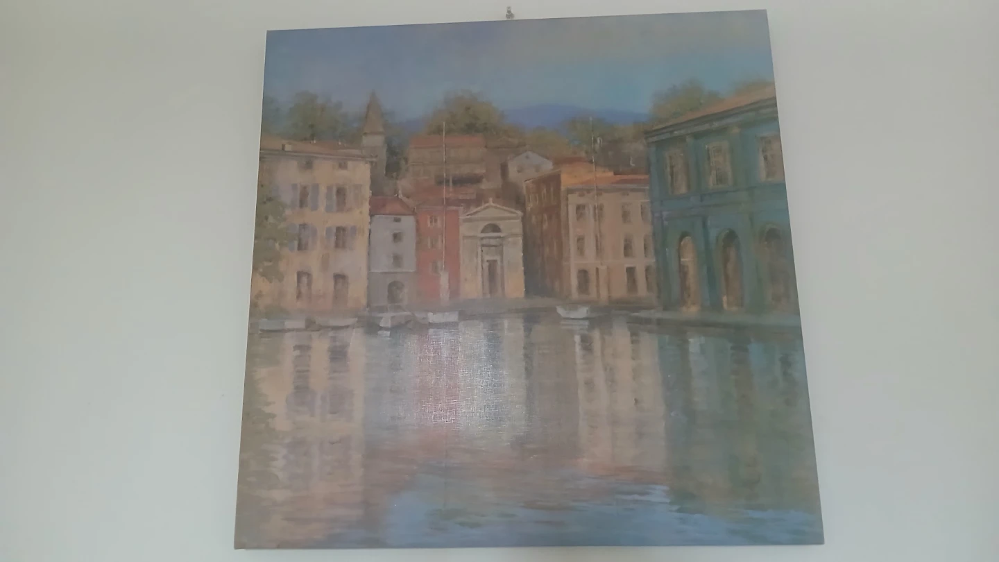 Painting of a European town by the water