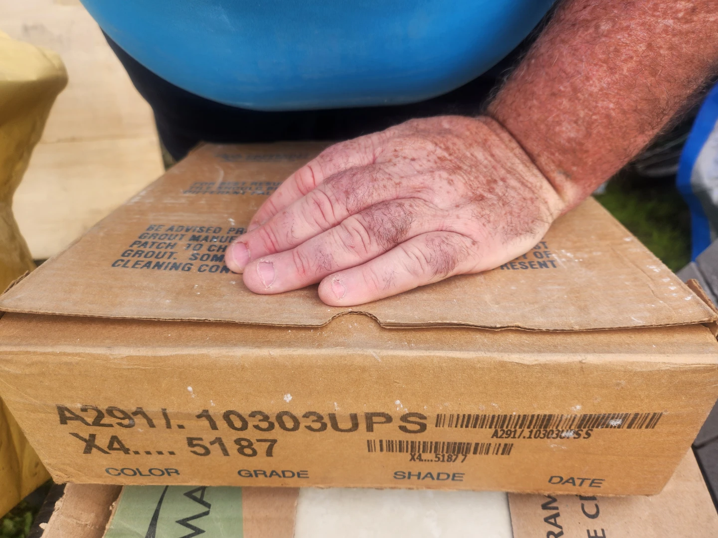 Box of white mosaic tiles