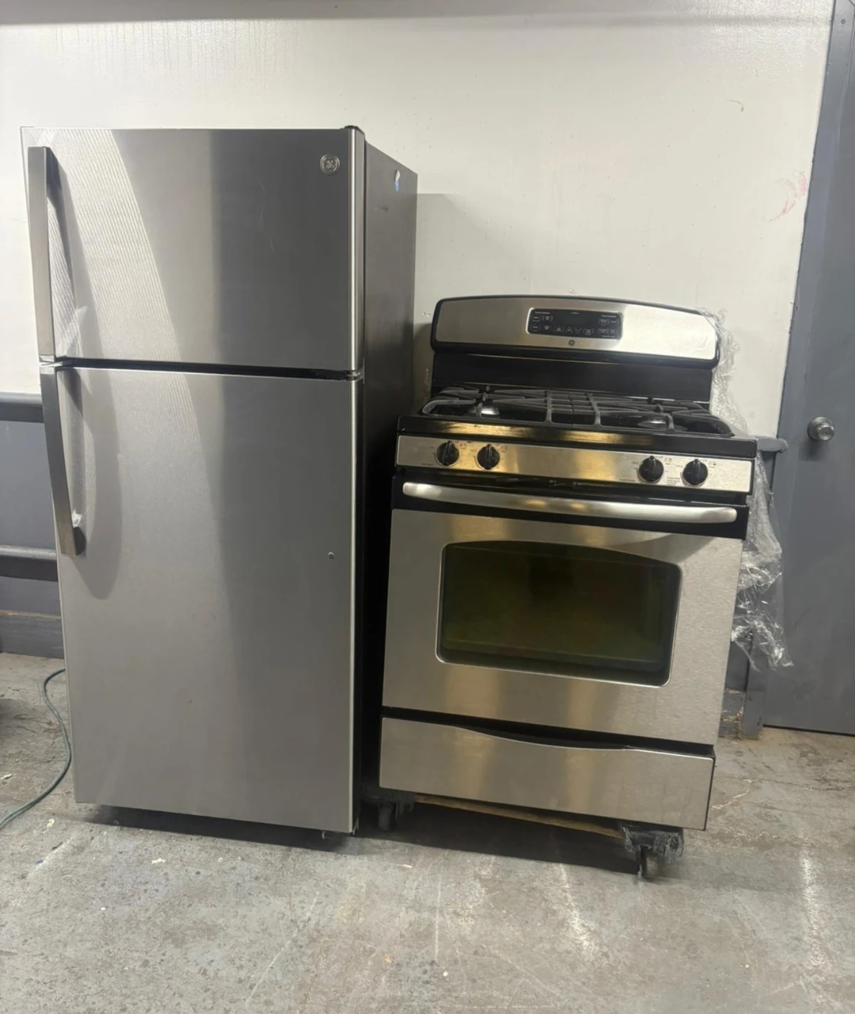GE 28in Stainless refrigerator and 30in gas stove