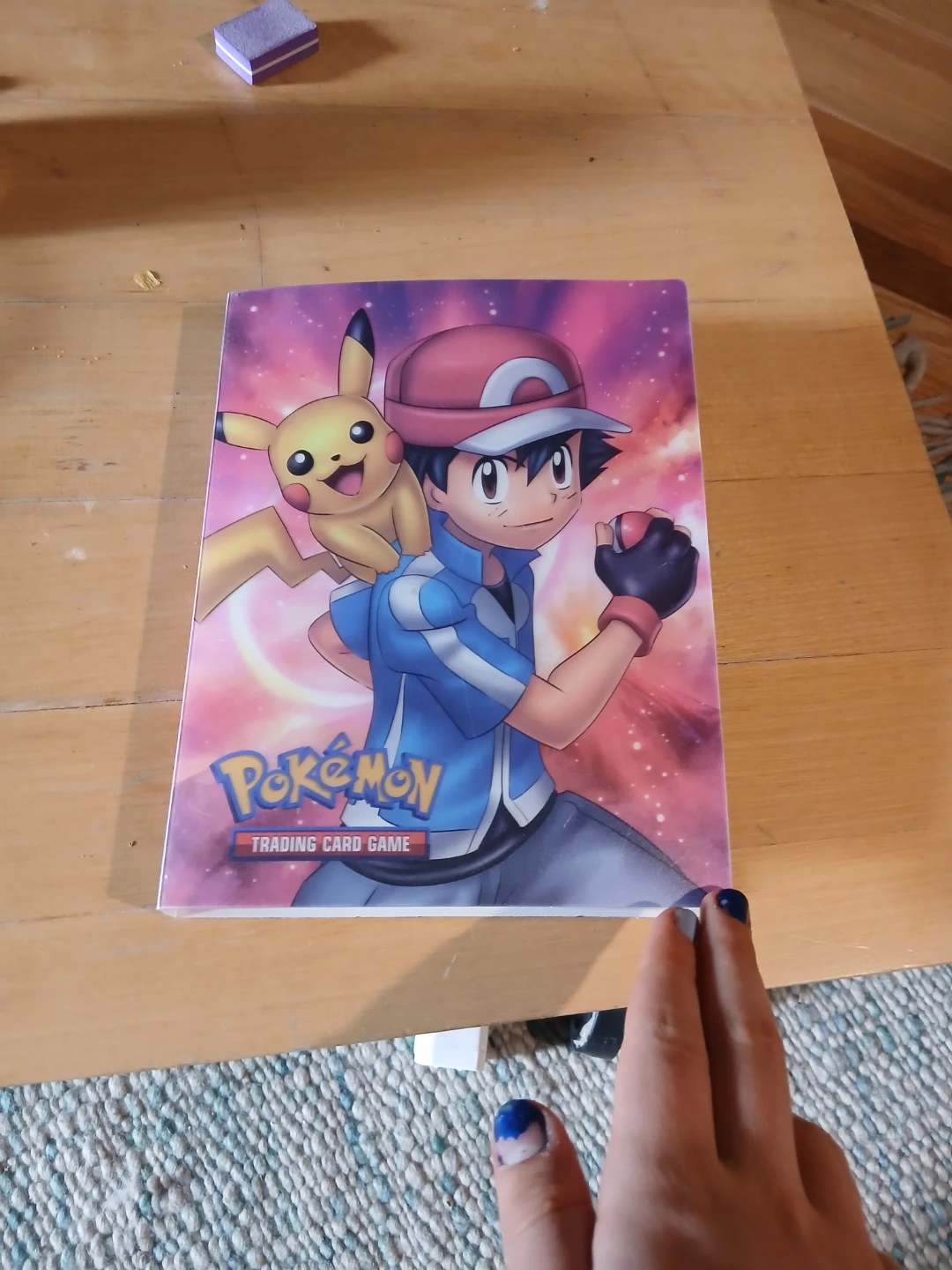 Pokemon Trading Card Binder half full with cards