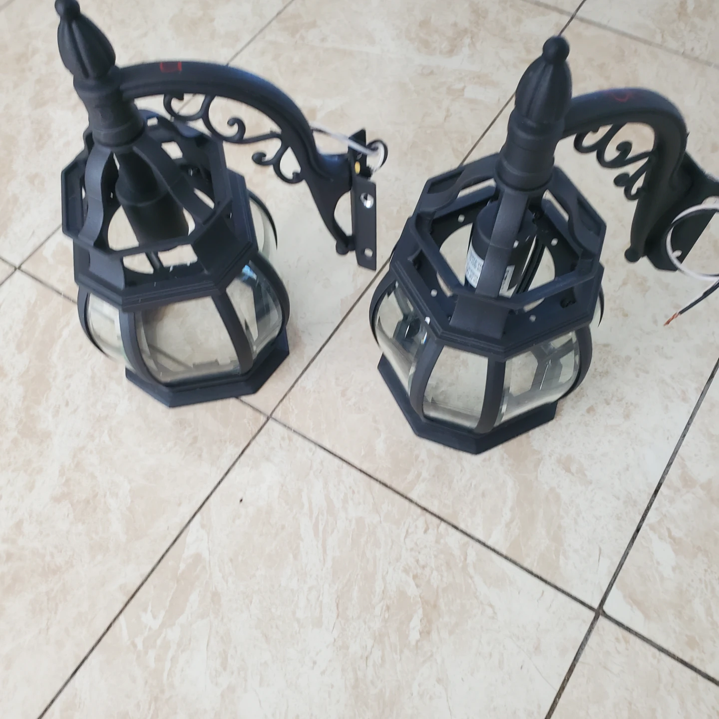 Pair of black outdoor wall lanterns