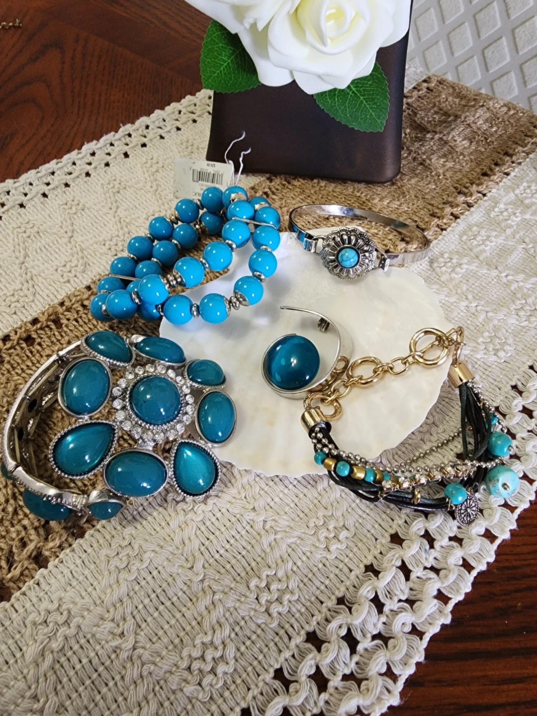 Assorted turquoise and silver tone bracelets