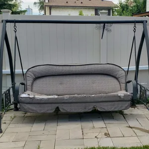 Outdoor swing with cushions