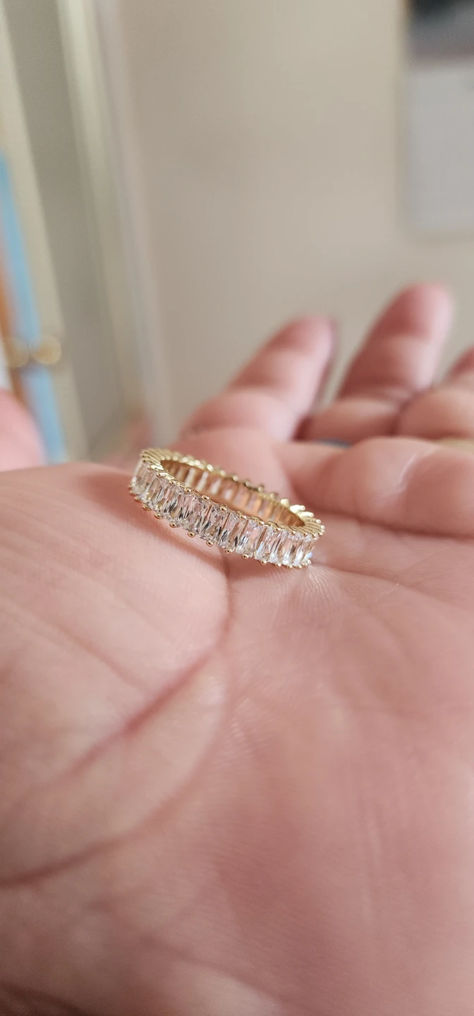Gold platted eternity band ring with clear baguette stones