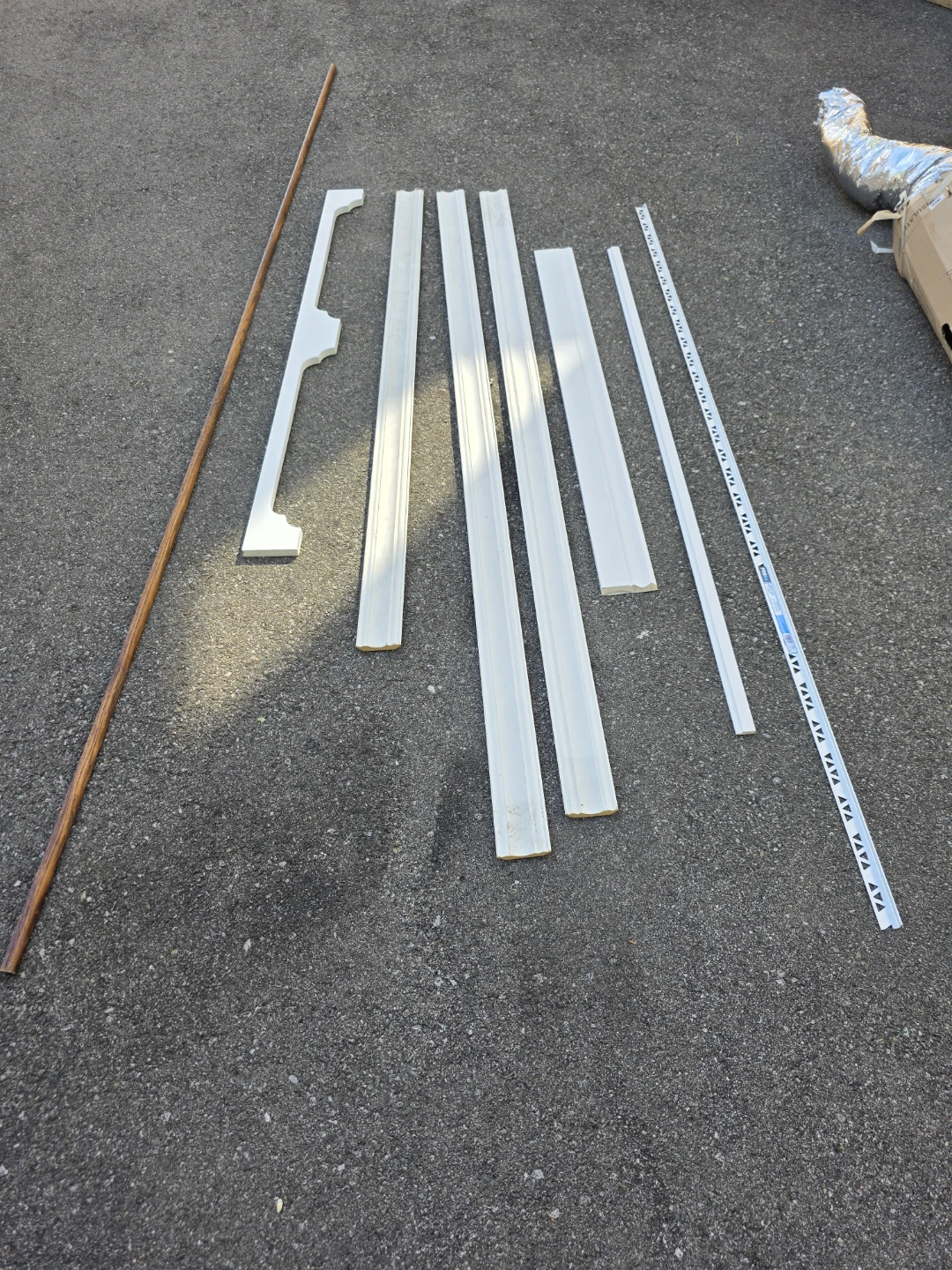 Assorted White Trim Pieces and Wooden Dowel