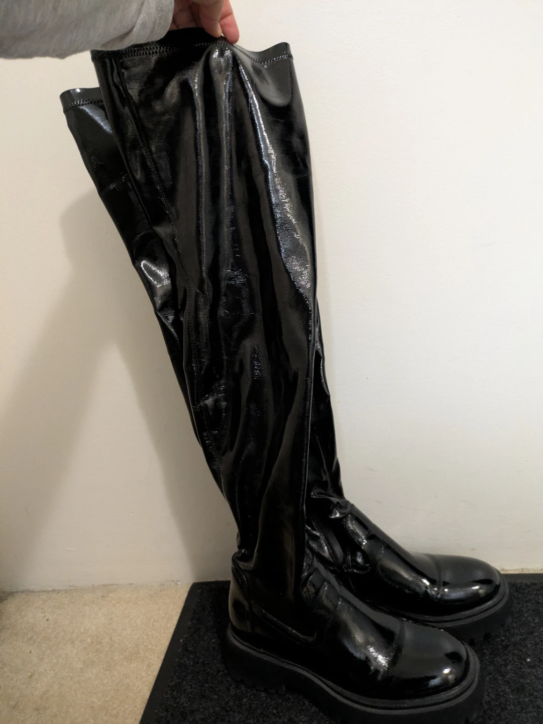 Black over-the-knee boots. Call it spring.
