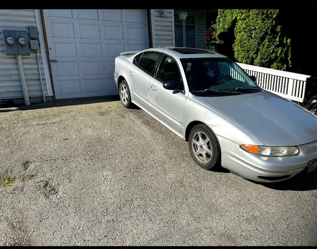 Silver Oldsmobile Alero Sedan - photo 2