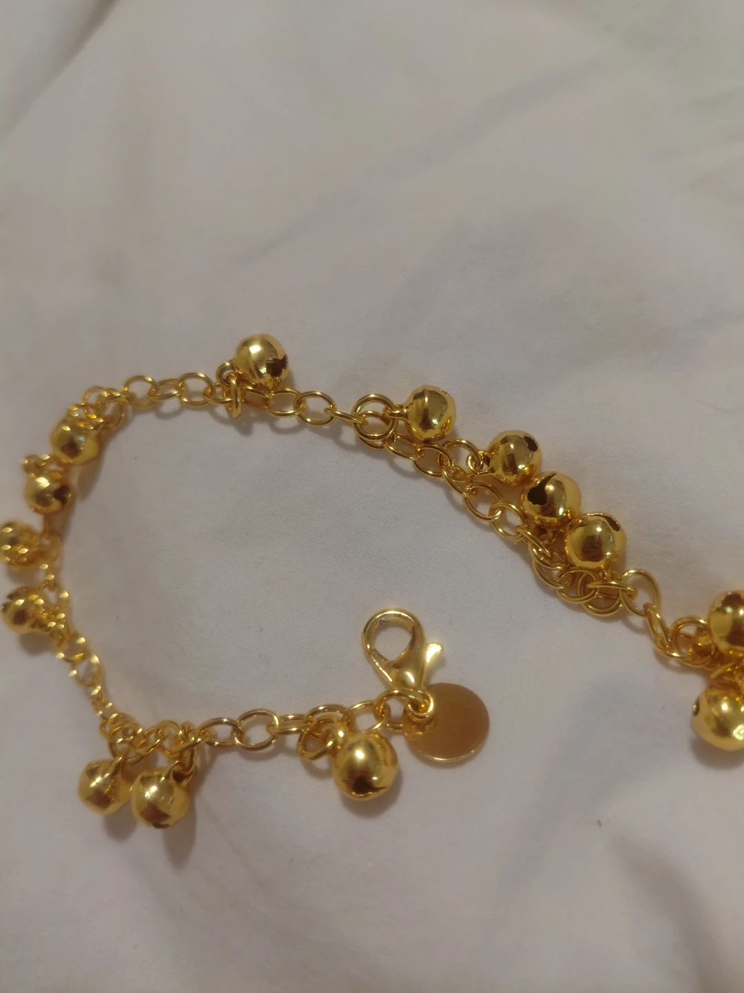 Gold-tone bracelet with charms