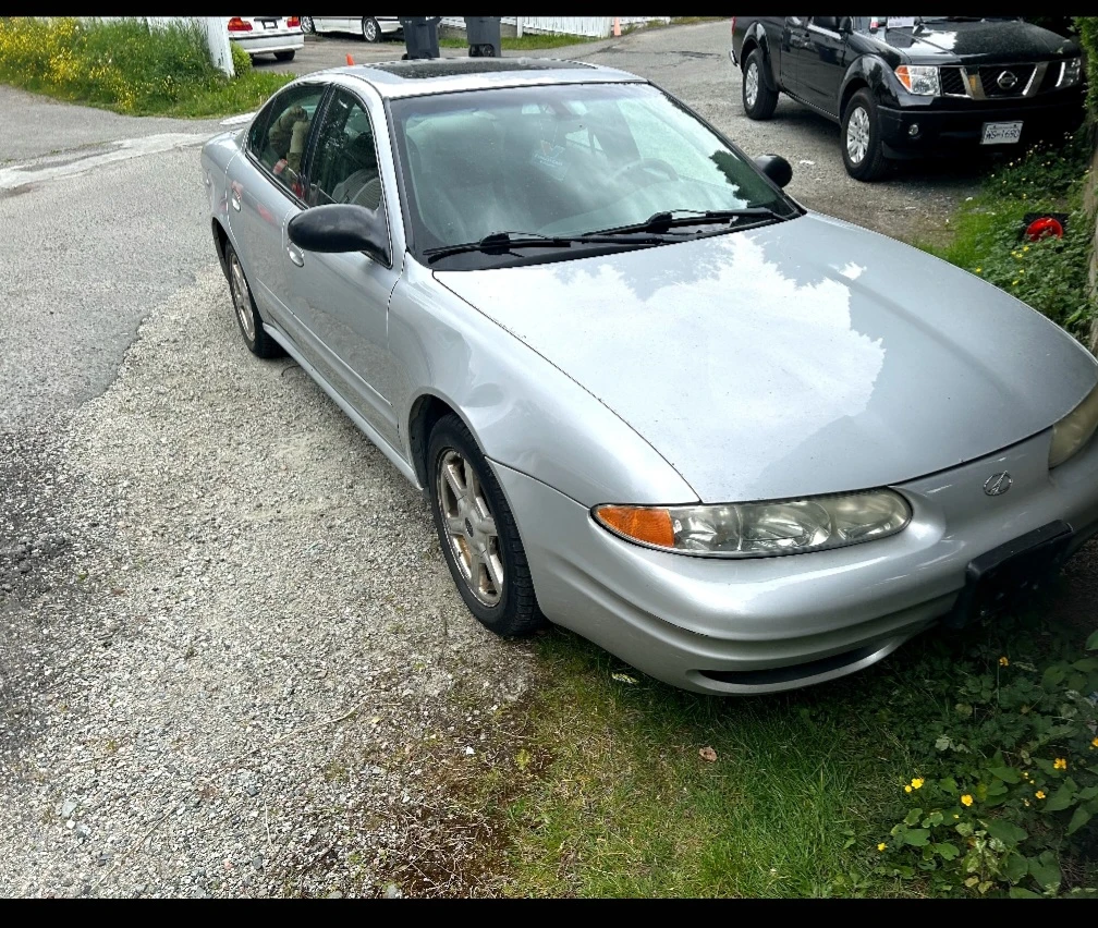 Silver Oldsmobile Alero Sedan