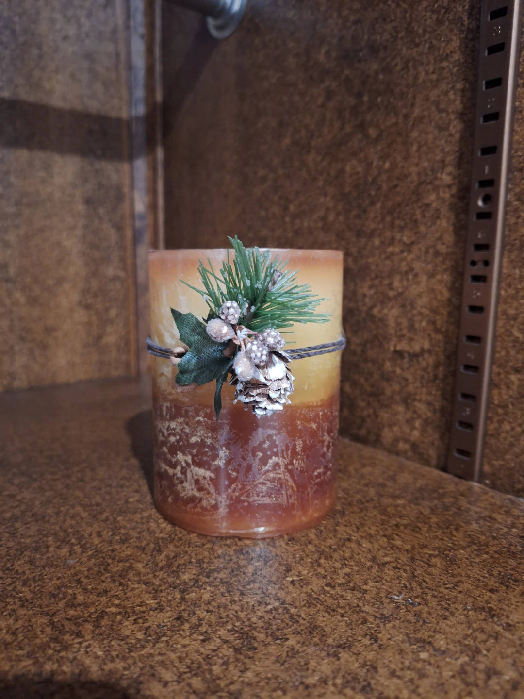 Decorative Pillar Candle with Pinecone Accent