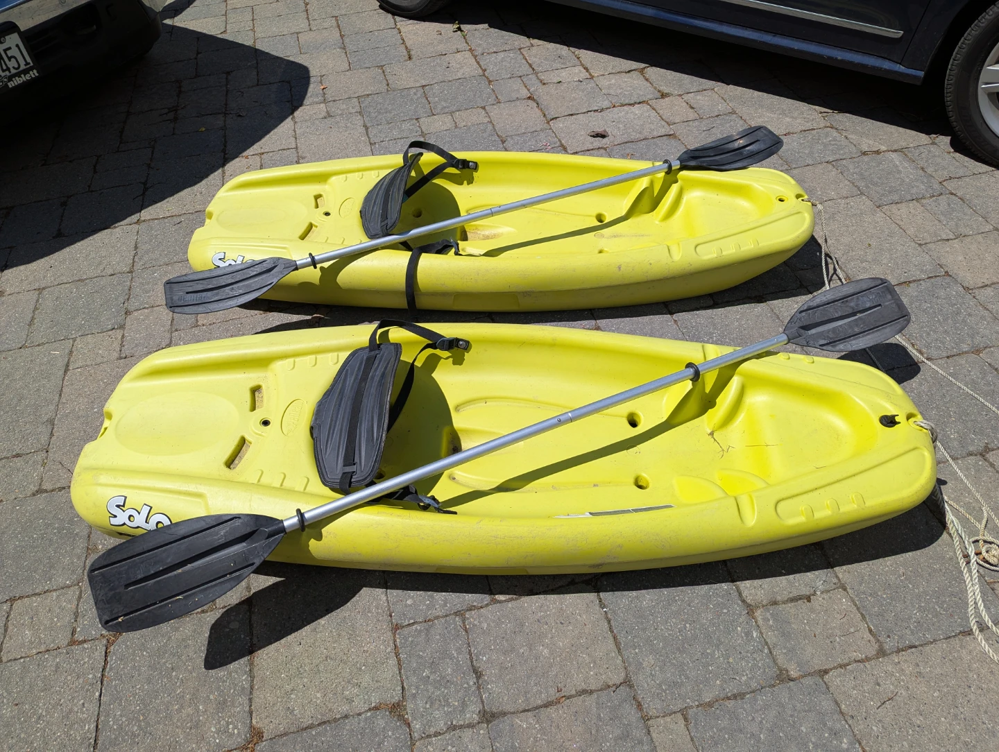 2 x Yellow Solo Kayaks with Paddles