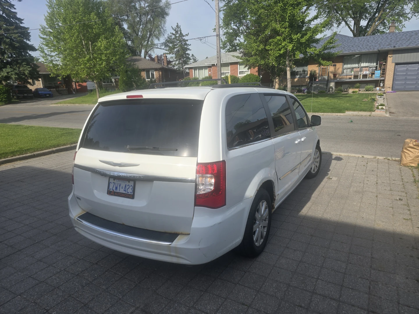 White Chrysler Town & Country Minivan - photo 3