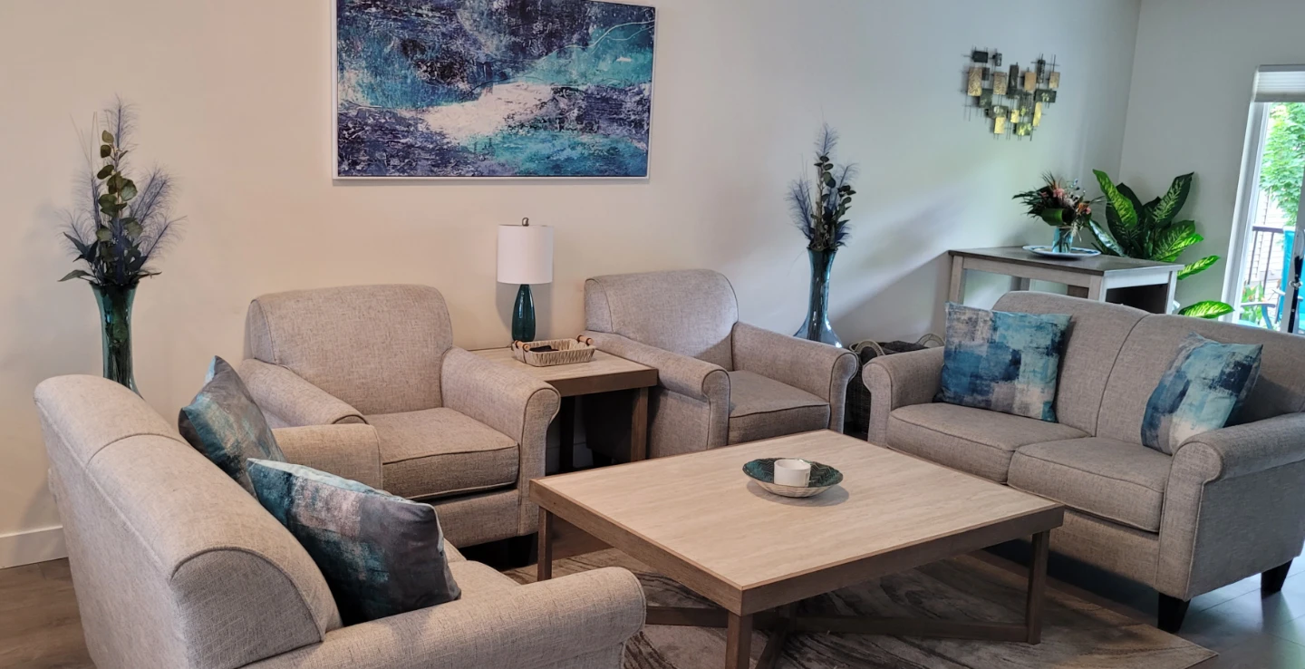 Light grey upholstered couch and armchairs set