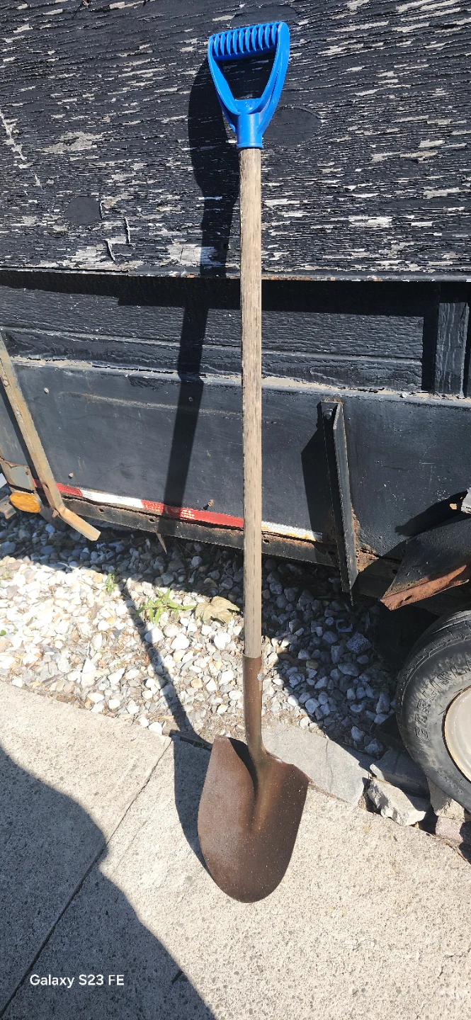 Used long Shovel with Blue Handle.