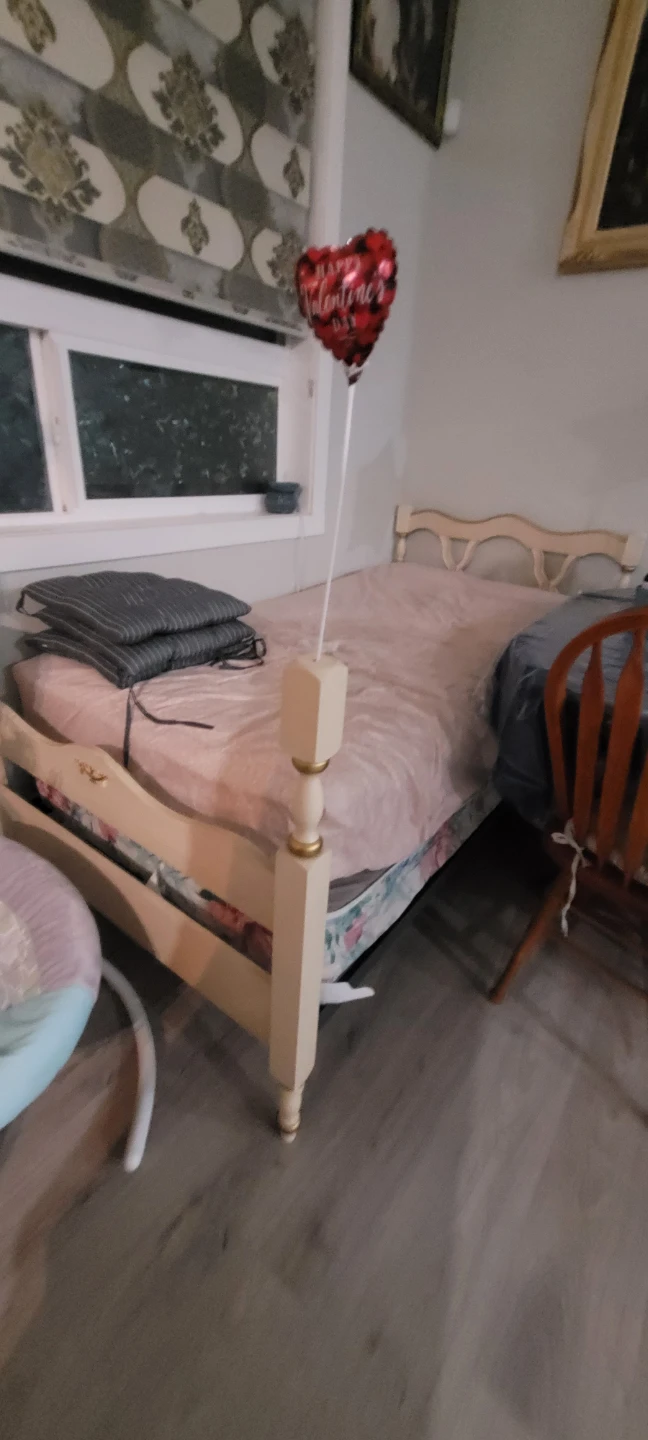Cream coloured single bed frame with mattress