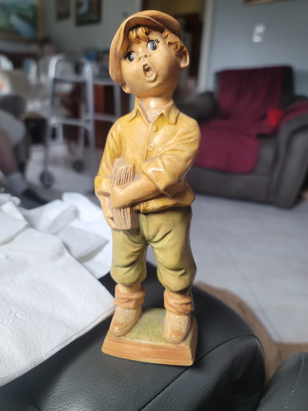 Boy Holding Newspaper Figurine