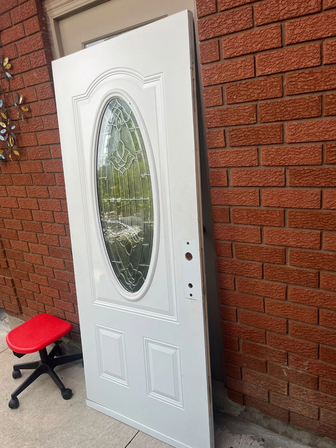 White Exterior Door with Oval Glass Insert