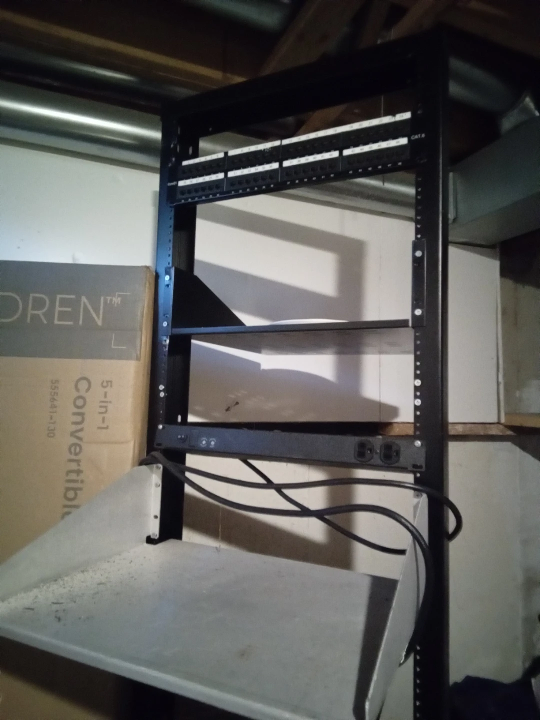 Black Server Rack with Shelves and Patch Panel