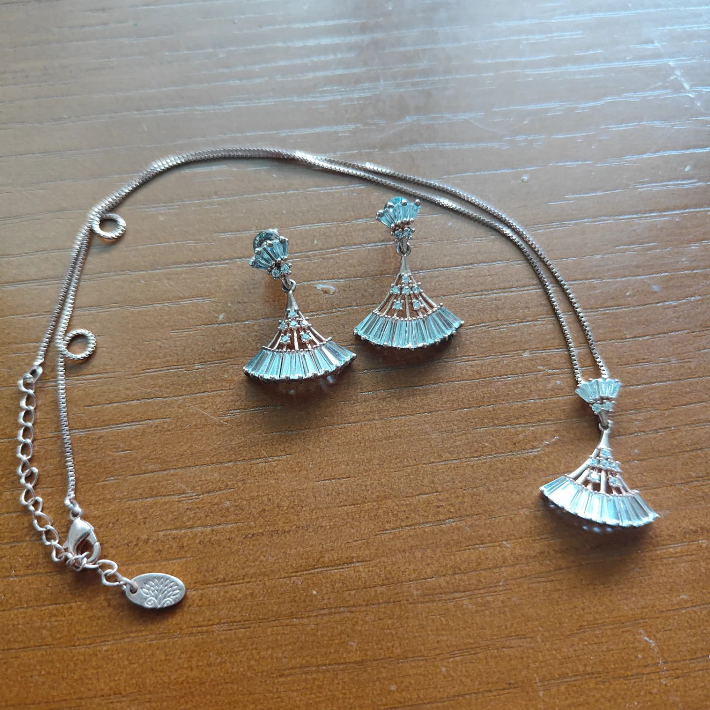 Gold toned earrings and pendant