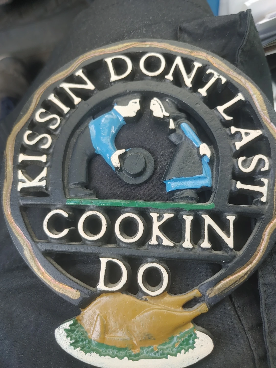 Cast Iron "Kissin' Don't Last, Cookin' Do" Sign