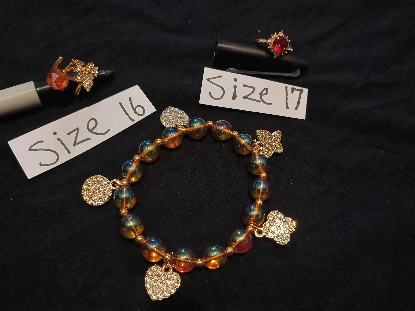 Beaded Bracelet with Charms and Red Gemstone Ring