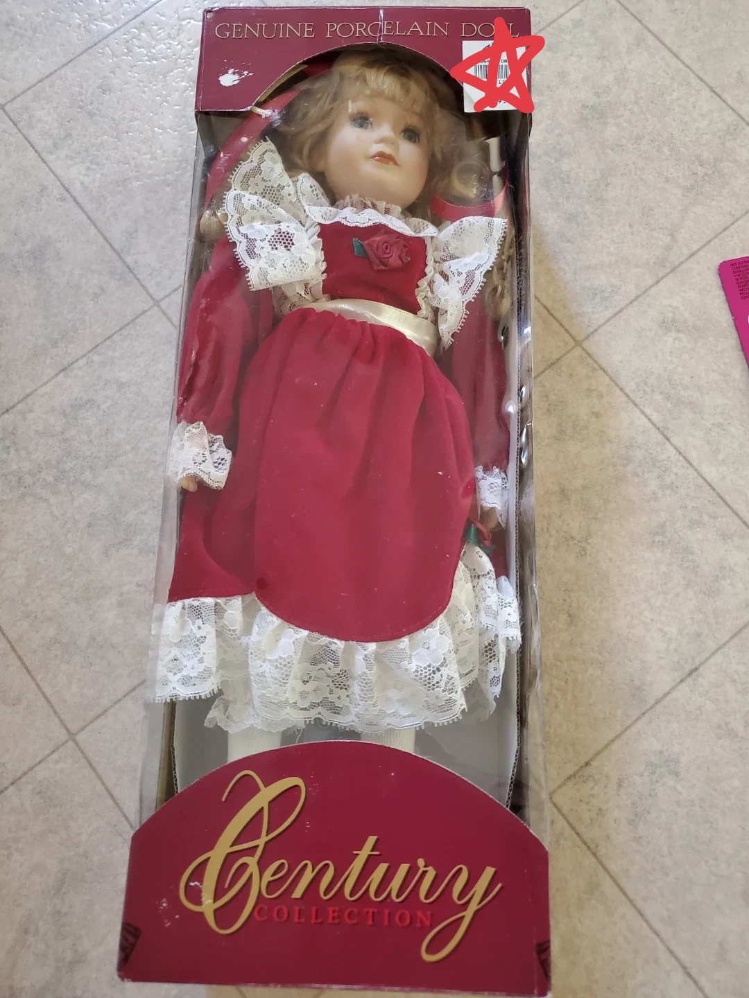 In box brand new- Century Collection Genuine Porcelain Doll