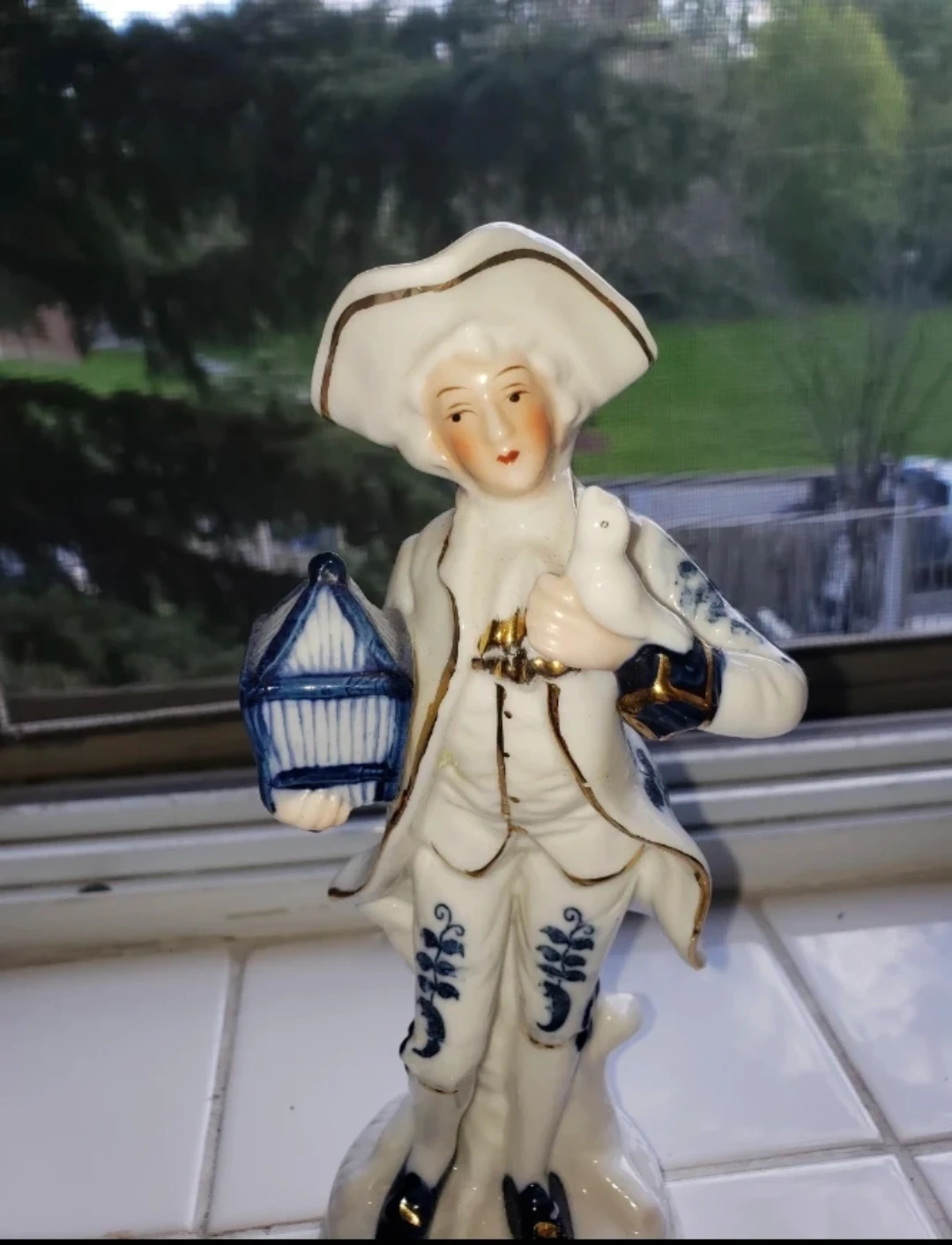 Porcelain Figurine Man with Bird Cage