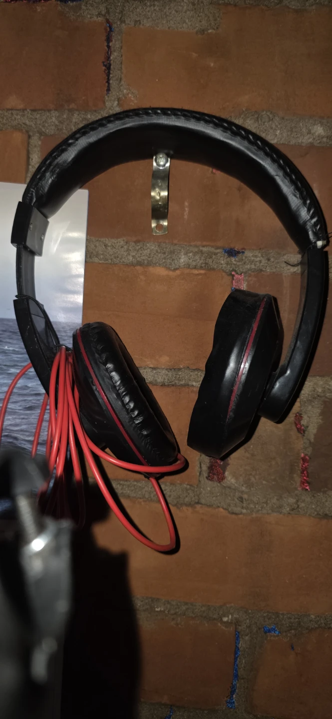 Black over-ear headphones with red cable