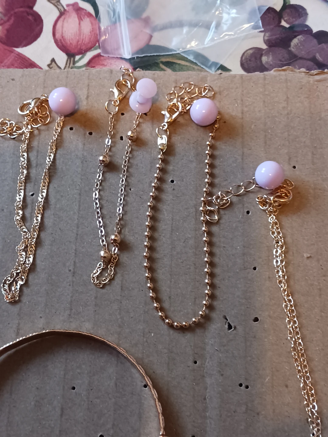 Gold-tone jewellery set with earrings, bracelets, and rings