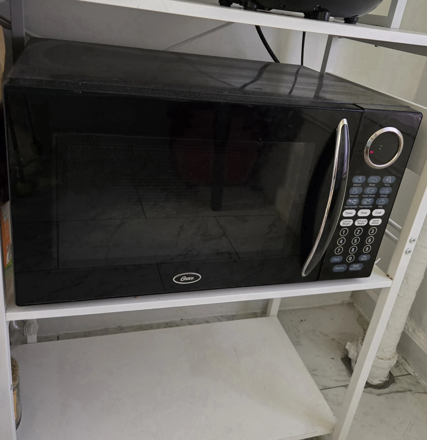 **Moving Sale** Oster Microwave