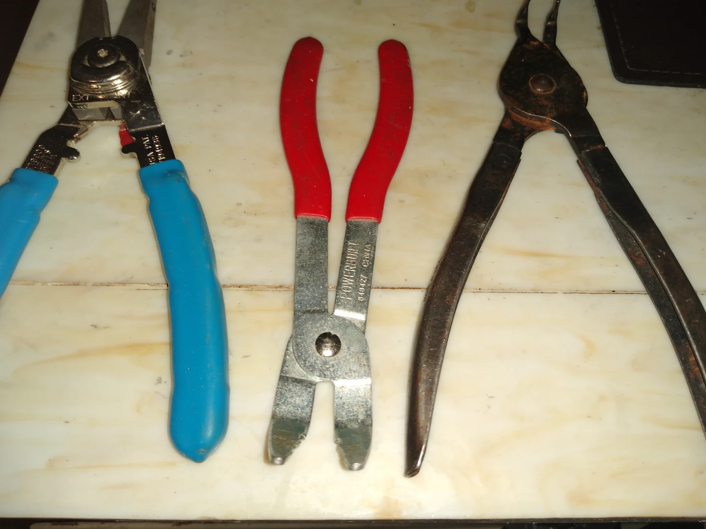 Set of three spark plug changing pliers