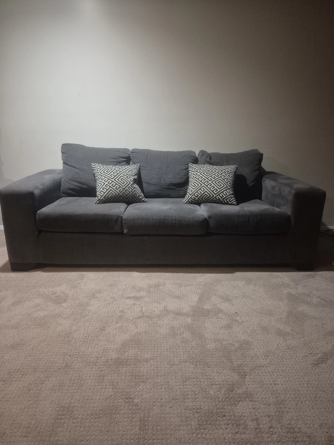 Grey Fabric Sofa with Two Throw Pillows