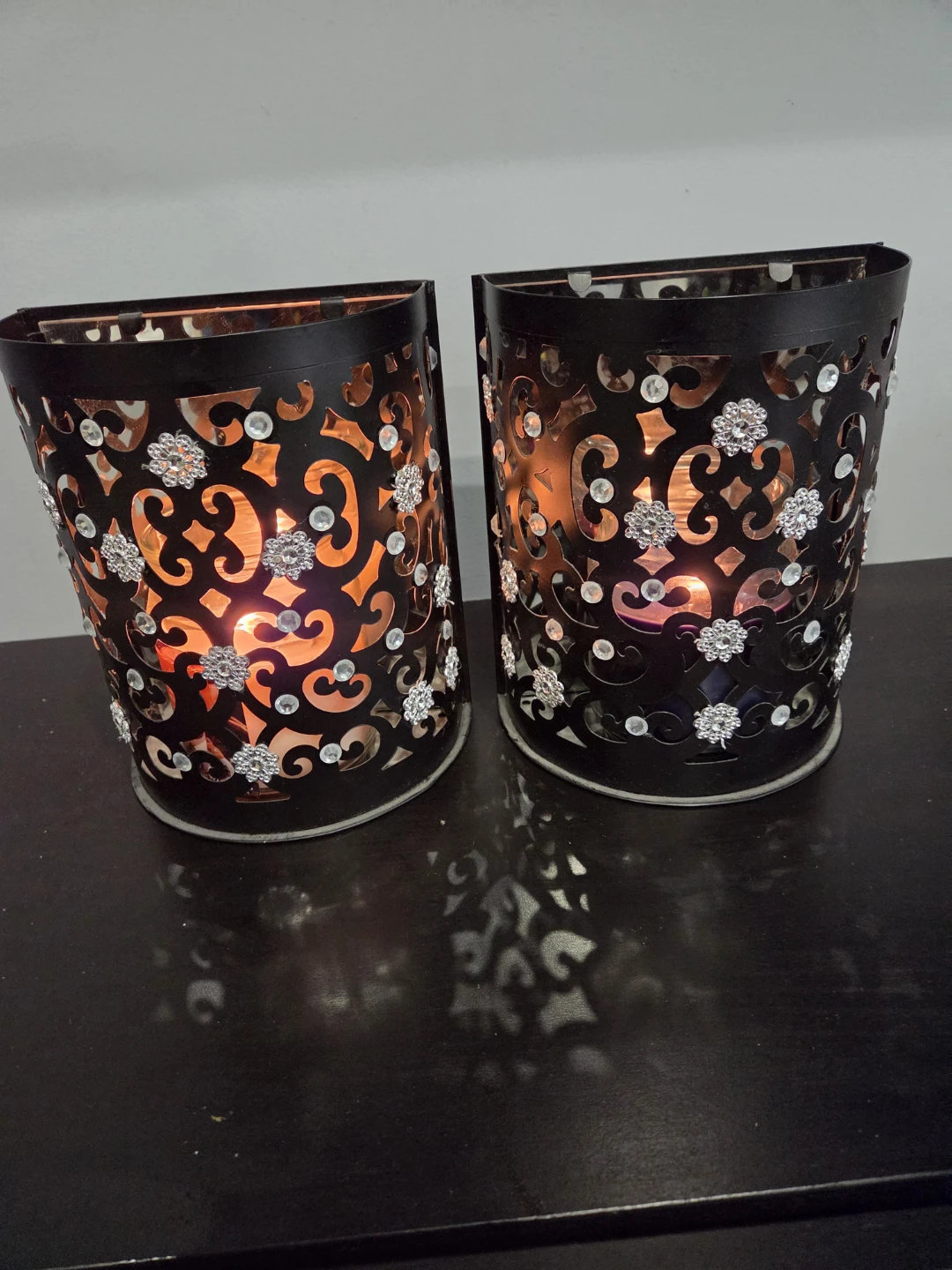 Pair of decorative metal candle holders