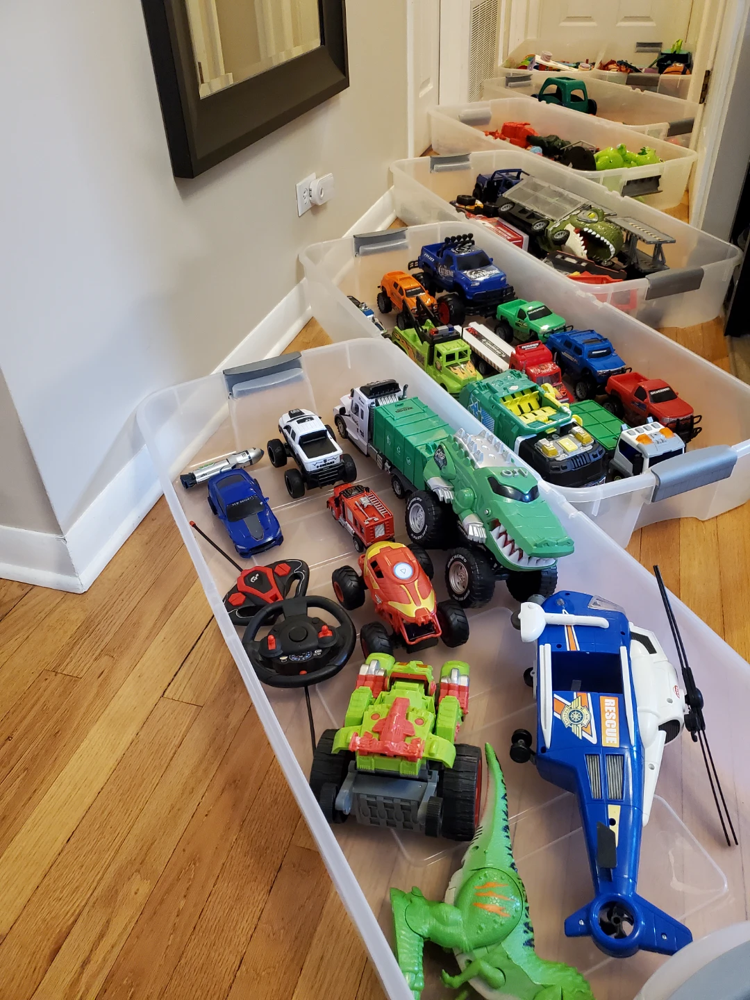 Assorted Dinosaur and Vehicle Toys few plastic containers