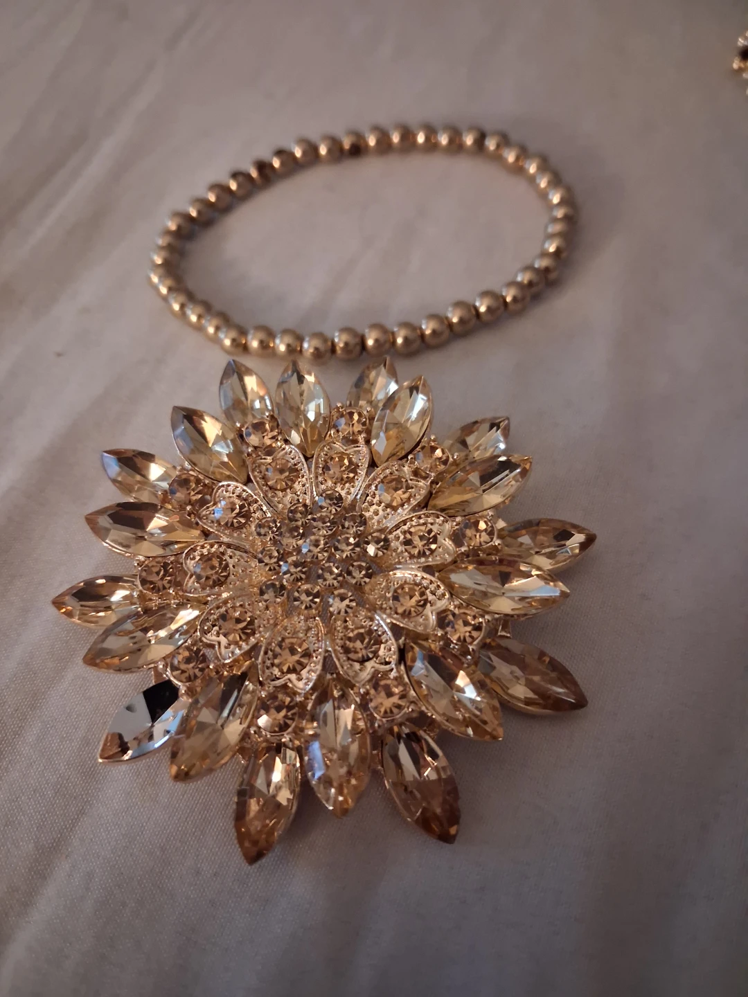 Gold Tone Crystal Flower Brooch & Beaded Bracelet Set