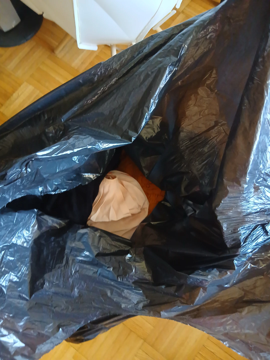 FREE Large garbage bag with assorted clothing inside