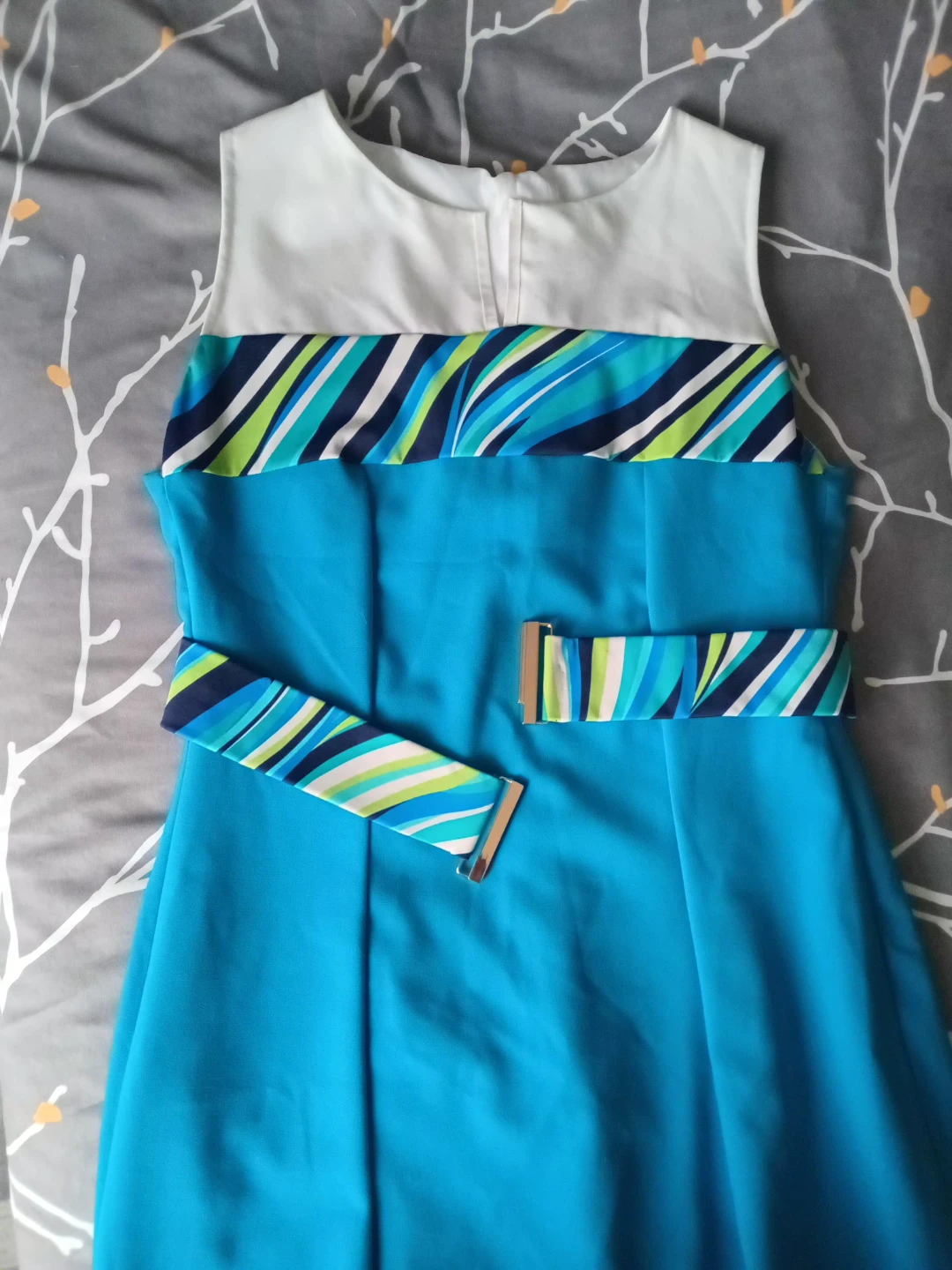 Blue sleeveless dress with colourful stripe accent