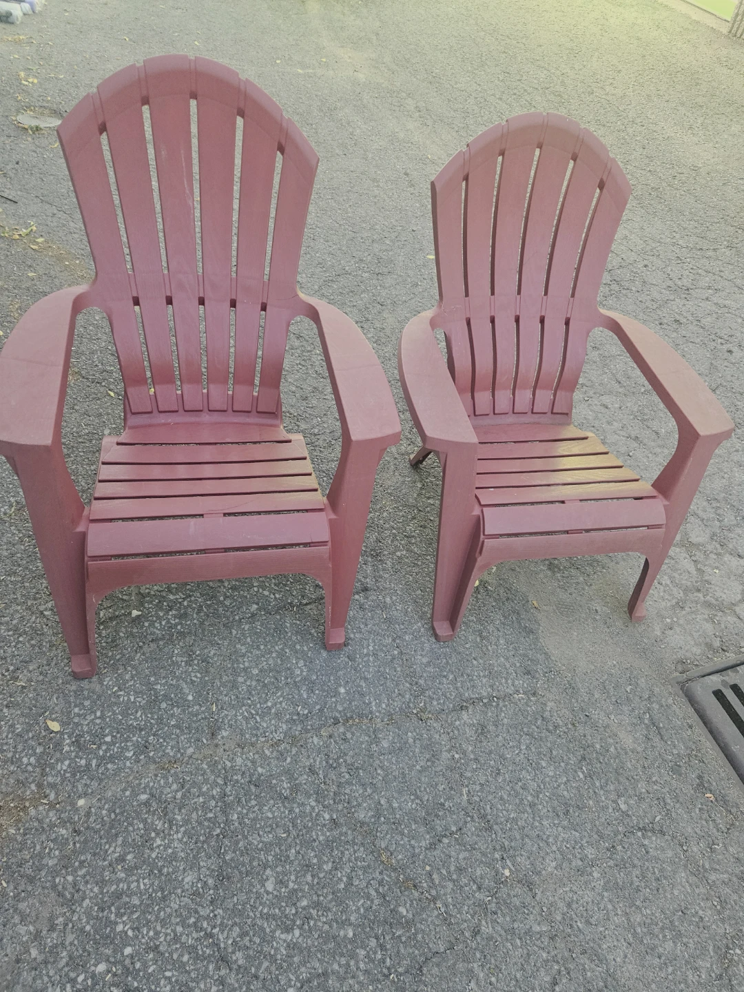 2 Red Plastic Adirondack Chairs