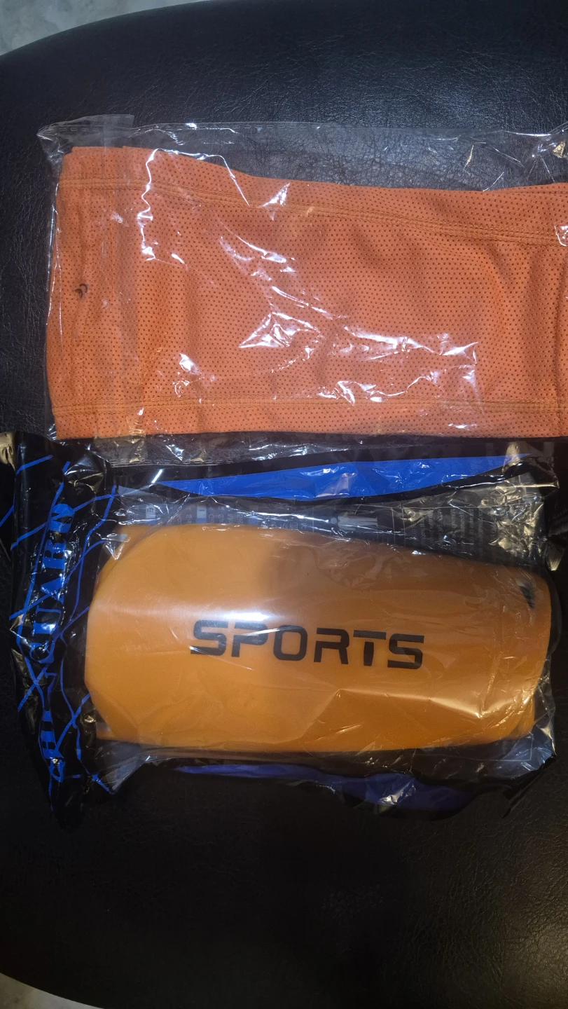 Sport shin guards with compression sleeves