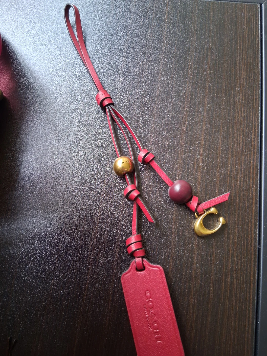 Coach leather charm