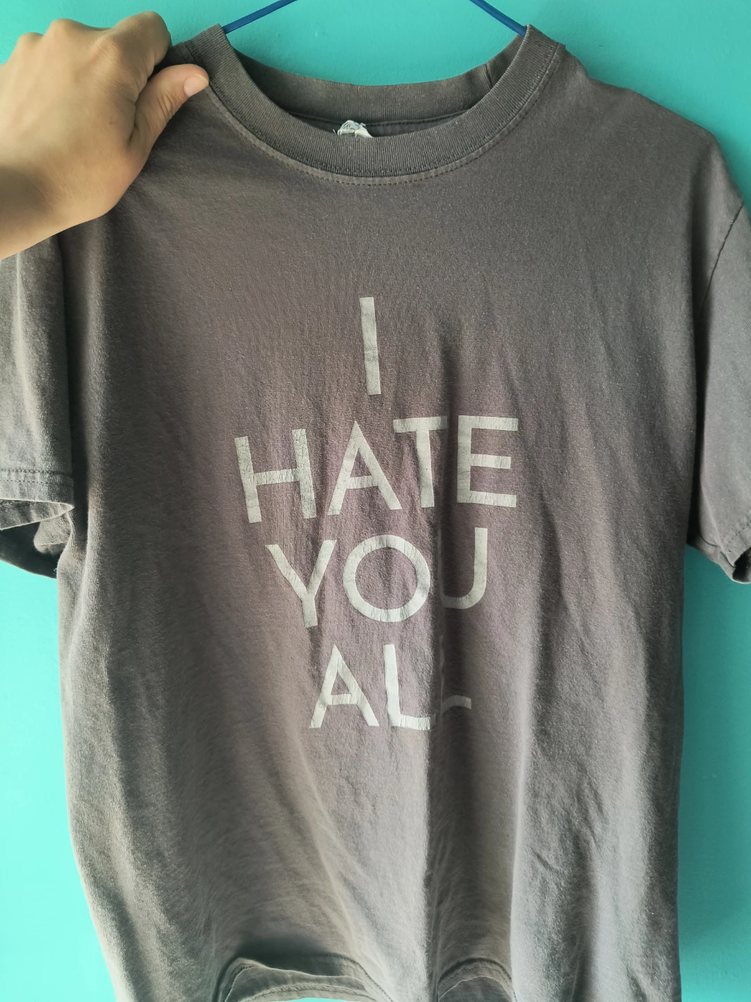 Grey T-shirt with "I HATE YOU ALL" graphic