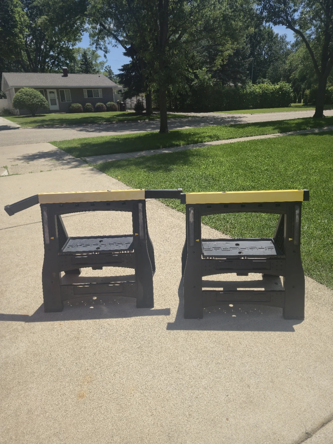 Two Black and Yellow Sawhorses